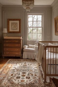 a baby's room with a crib, rocking chair and large rug on the floor