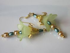 Lucite Flower Earrings Beaded Flower Dangle Light Golden | Etsy Green Czech Glass Flower Earrings, Gold Flower-shaped Czech Glass Earrings, Gold Flower-shaped Earrings With Czech Glass, Gold Flower Earrings With Czech Glass, Elegant Czech Glass Flower Earrings, Delicate Green Flower Earrings, Lucite Flower Earrings, Green Lily, Fantasy Earrings