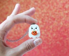 Funny Handmade Ghost Necklace made by me of Polymer Clay.No matter how old are you, it can be funny gift for everyone (:Approximate dimensionsNecklace:height: 3 cm. (  1.2"  )width: 2 cm.  (  0.8"  )chain length : 50cm. ( 20" )Earrings:height: 2.5 cm. (  1"  )width: 2 cm.  (  0.8"  )Keychain:height: 3 cm. (  1.2"  )width: 2 cm.  (  0.8"  )Brooch:height: 3 cm. (  1.2"  )width: 2 cm.  (  0.8"  )-Jewelry packed in little brown crafts box (:-All my jewelry are completely handmade so it can be slight Fun White Necklaces For Gifts, Fun White Halloween Jewelry, Fun White Jewelry For Halloween, White Handmade Kawaii Jewelry, Handmade White Kawaii Jewelry, Novelty White Handmade Necklace, Handmade White Kawaii Necklace, Handmade White Novelty Necklace, Handmade Orange Jewelry For Birthday