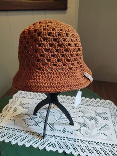 A granny stitch sun hat made from 100% cotton. Machine washable (gentle cycle, cold water); hang or lay flat to dry. Lightweight Brown Bucket Hat, Lightweight Brimmed Crochet Hat For Outdoor, Lightweight Brown Bucket Hat In One Size, Lightweight Brown Bucket Hat With Short Brim, Lightweight Curved Brim Crochet Hat For Outdoor, Lightweight Crochet Hat With Curved Brim For Outdoor, Lightweight Brown Crochet Hat, Lightweight Brown Crochet Hat, One Size Fits Most, Brown Brimmed Cotton Bucket Hat