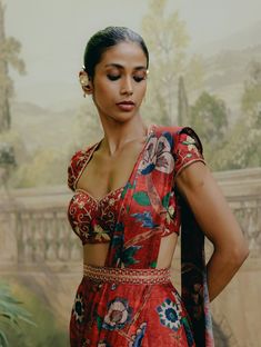 Shine in a red mix print pre-draped sari in dupion silk, elegantly paired with an intricately embroidered blouse. This ensemble offers a seamless blend of vibrant prints and detailed craftsmanship for a striking, sophisticated look. Elegant Pre-draped Saree With Printed Motifs For Diwali, Festive Silk Pre-draped Saree With Printed Motifs, Festive Red Pre-draped Saree With Printed Motifs, Brocade Pre-draped Saree With Resham Embroidery, Traditional Pre-draped Saree With Floral Print, Elegant Brocade Pre-draped Saree For Designer Wear, Navratri Party Pre-draped Saree With Printed Motifs, Elegant Multicolor Cotton Silk Pre-draped Saree, Elegant Floral Print Choli For Diwali