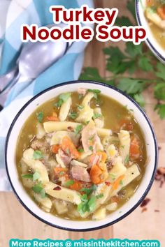 two bowls of turkey noodle soup on a wooden table