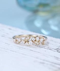 two gold rings with white diamonds on top