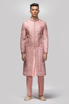 Onion pink raw silk sherwani with all over floral jaal pattern, tonal dori, kiran, dabka pitta and sequin embroidery. Paired with kurta and straight pyjama.
Components: 3
Pattern: Embroidered
Type Of Work: Dori, Dabka, Sequin and Kiran Work
Neckline: Mandarin Collar
Sleeve Type: Full Sleeves
Fabric: Raw Silk
Color: Pink
Other Details: 
Approx. product weight: 2 kgs
Sherwani Closure: Front concealed placket
Occasion: Groom,Wedding - Aza Fashions Onion Pink, Embroidered Sherwani, Neeta Lulla, Ritu Kumar, Tarun Tahiliani, Sequin Embroidery, Indian Fashion Designers, Pernia Pop Up Shop, Sequins Embroidery