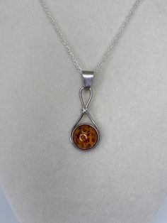 This listing is for one Beautiful Vintage Sterling Silver Amber Pendant with Free Chain. The Pendant that you see in the pictures / video is the exact item that you will receive. Free Gift with every order Size- 14.5mm wide by 30mm tall  Weight- 2.5 grams  Uses/Properties  -Amber is A fossilized resin from ancient trees- * Known as a master healer and cleanser of the mind,body , and spirit .  * Helps with using  creativity, talents and particular gifts to call continuous abundance into our lives.  * Helps to cleanse and clear sacral chakra  * The stone of courage and strength  * Helps your energy remain focused. * Luck and Success  ✨Amber also has many health healing properties but I will let you do the research on those✨ Chakra: Solar Plexus, Sacral Disclaimer- The properties provided by Ancient Tree, Sacral Chakra, Baltic Amber, Plexus Products, Picture Video, Vintage Sterling Silver, Amber, Free Gifts, Jewelry Necklace Pendant