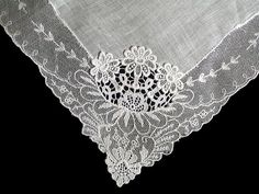 New old stock vintage wedding hanky with a fancy applique and lace border. Although never used, this hanky is slightly imperfect. Please view all photos, as you will see a couple of very small tears in the lace and a small tear in the linen center. Still very pretty, and perfect for a bride-to-be as her something old. All white, measuring 11 inches, and made of linen. Being sold AS IS, and priced accordingly. Elegant Lace Handkerchiefs With Lace Trim, Vintage Lace With Lace Trim For Ceremony, Elegant Lace Wedding Handkerchief, Elegant Wedding Handkerchief With Lace Work, Elegant Lace Work Handkerchief For Wedding, Elegant Lace Work Wedding Handkerchief, Lace Handkerchiefs With Lace Trim For Wedding, Lace Wedding Handkerchiefs With Lace Trim, Vintage Embroidered Lace For Wedding