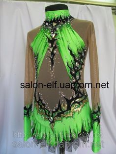 a woman's green and black latin dance dress with sequins on it