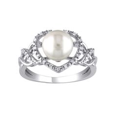 Beautifully adorned with a lustrous cultured pearl and dazzling round-cut diamonds, this Stella Grace heart ring is a sweet addition to your look.Click on this JEWELRY & WATCHES GUIDE to learn about fit, styles, materials and more! Width: 11.3 mm Metal: sterling silver Plating: rhodium Finish: polished Packaging: boxedDIAMOND DETAILS Total weight: less than 1/10 ct. Shape: round Setting: prongCULTURED PEARL DETAILS Type: freshwater Size: 8 mm - 8.5 mm Shape: round Color: white Diamond weights ar Diamond White Pearl Ring With Diamond Accents, Elegant Diamond White Pearl Ring With Diamond Accents, White Gold Pearl Ring With Diamond Accents For Promise, Pearl Ring With Diamond Accents, Elegant Pearl Ring With Diamond Accents For Anniversaries, Pearl White Diamond Pearl Ring With Diamond Accents, Pearl White Pearl Ring With Diamond Accents, Pearl White Diamond Pearl Ring With Accents, Elegant Pearl Ring With Diamond Accents For Anniversary