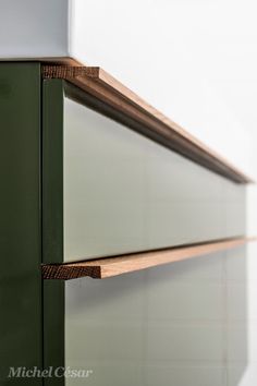 a close up of a green cabinet in a room