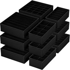 six black plastic drawers stacked on top of each other