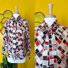 A B O U T Circa: 70s  Brand/Tag: No tag listed  Condition: Flaws/wear to be expected on all of our items. Our items are vintage, which means they are PRE-LOVED. Missing bottom button. Details: Vntg 70s Bow Tie Collared Blouse Geometric Checkered Pattern Print M/L  S I Z I N G    * ALL ITEMS ARE MEASURED FLAT * To find the circumference of a measurement, simply double. This will be your accurate size.  Any tags listed are considered "vintage sizing", so please make sure to check measurements for Fall Retro Blouse With Vintage Print, Retro Vintage Print Blouse For Fall, Retro Blouse With Vintage Print For Fall, Fall Vintage Print Tops, Retro Print Fall Tops, Fall Vintage Blouse With Vintage Pattern, Vintage Blouse With Vintage Pattern For Fall, Retro Fall Tops With Retro Print, Retro Fall Blouse With Graphic Print