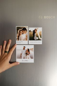 a hand is holding up three photos on a refrigerator door with the word bosch above them