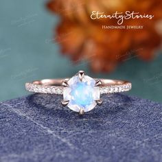 an engagement ring with a blue topazte stone in the center