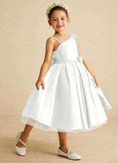 Complete your bridal party with our modern matte satin flower girl dress, Lollipop. Her one-shoulder neckline is complemented with a bow at the shoulder and bow belt. The skirt is ruched beautifully to flare as she walks down the aisle.