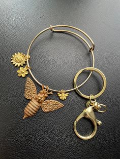 Delicate and pretty keychain, perfect for someone on the go! Brass materials. Keychain Charm, Feb 8, Brass Material, Bumble Bee, Alex And Ani Charm Bracelet, Keychains, The Go, Charm Bracelet, Brass