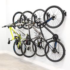 there are many bikes hanging on the wall