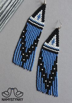 These blue fringe beaded earrings are made of high-quality Czech beads and strong synthetic thread. They are elegant, fashionable, and highly versatile, suitable for everyday wear. Features: Sterling silver components Color: black, blue, white Length (approximate): 10 cm (3.93 in) This item is currently in stock. You must be completely satisfied. If you find merchandise unsatisfactory for any reason, return it within 10 days and your money will be refunded without questions. More beaded earrings