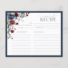 a recipe card with red flowers and greenery on the front, sitting on a marble surface