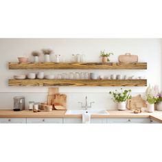 two wooden shelves above a kitchen sink filled with dishes