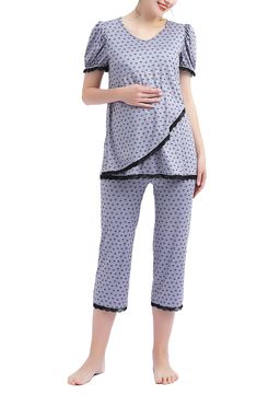 A supersoft pajama top is designed to adapt to your changing body during and after pregnancy with a flattering V-neckline and a flowy tulip-style hem. Comfy capri-length pants and inky lace trim complete the cozy sleep set. 27" top length; 21" inseam; 18" leg opening; 15 1/2" rise Top has V-neck; short sleeves 95% rayon, 5% spandex Machine wash, tumble dry Imported Spring Maternity Nursing Friendly Sleepwear, Summer Maternity Sleepwear, Nursing Friendly, Spring Nursing Friendly Sleepwear, Cozy Sleep, Maternity Pajamas, After Pregnancy, Sleep Set, Pajama Top, Sleepwear Women