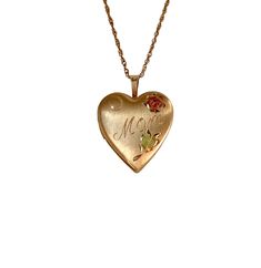 Beautiful vintage 14K Gold Filled PPC heart locket necklace. This lovely locket features hand engraved leaves and floral and in the center is signed "Mom". The inside of the locket has space for two photos. The heart has a two tone finish - shimmering satin with the Pink Gold flower and glossy finish. The contrast is absolutely gorgeous. Lovely hand carved delightful pattern design. The locket opens with ease and closes with a strong snap.  The locket hangs on 14k gold filled chain is 18". This Luxury Antique Necklaces With Heart Charm, Vintage 14k Gold Locket Necklace Stamped 14k, Vintage Necklace For Valentine's Day Memorial, Vintage Necklaces For Valentine's Day Memorial, Vintage 14k Gold Locket Necklace, Antique Engraved Necklaces For Mother's Day, Vintage Gold Jewelry With Birth Flower Detail, Vintage Gold Jewelry With Birth Flower, Vintage Locket Necklace With Hallmark For Memorial