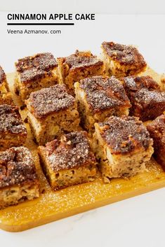 cinnamon apple cake sitting on top of a cutting board