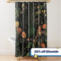 the shower curtain is decorated with flowers and leaves