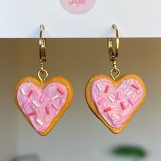 Heart Sugar Cookie Polymer Clay Earrings with round lever back. Glossed. Food jewellery. Unique Earrings. Valentine's earrings. The perfect little treat to wear adding sweetness to your whole look. Perfect for valentine's day 🥰💗Enjoy! x *I DO NOT SEND TO GERMANY* Hypoallergenic Round Earrings For Valentine's Day, Pink Round Earrings For Valentine's Day, Cute Earrings For Mother's Day With Ear Wire, Cute Mother's Day Earrings With Ear Wire, Valentine's Day Round Earrings With Ear Wire, Pink Dangle Hoop Earrings For Valentine's Day, Sweet Pink Heart-shaped Earrings, Round Valentine's Day Earrings With Ear Wire, Sweet Pink Earrings As Gift