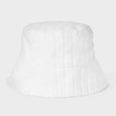 Bring a fun update to your sunny weather look with this Poly Jacquard Terry Bucket Hat from Shade & Shore™. Designed in a classic silhouette featuring a curved crown and a slanted brim, this bucket hat help keep the direct sun out of your eyes. Made from midweight fabric with soft lining for comfortable wear, it features a woven striped jacquard-knit outer in a solid hue, making it a great complement to a variety of casual ensembles. Shade & Shore™: Found exclusively at Target. Classic Hats With Uv Protection For Spring, Spring Cotton Hat With Uv Protection, White Cotton Vacation Hat, Trendy White Brimmed Bucket Hat, White Cotton Sun Hat With Short Brim, White Cotton Summer Sun Hat, Solid Curved Brim Bucket Hat For Spring, Solid Bucket Hat With Curved Brim For Spring, Classic Solid Bucket Hat For Beach