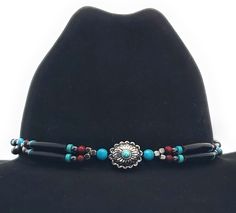 Western Silver Concho Hat Band - Black Buffalo Horn Hairpipe beads with turquoise color, silver, hematite and dark red wood accent beads with decorative metal concho centerpiece (see picture for different concho centerpieces).  Includes buckskin adjustable tie in back.   2 Row hatband measures approximately 23" in length (without buckskin tie) and 3 Row hatband measures 23.5" and can be made up to 25" (just put in personalization)  Both shown on a Size 7 cowboy hat.  Designed and handmade by me.  Genuine Buffalo Horn Beads.   See my other hatbands:  https://www.etsy.com/shop/BlueEyesDesignsHB?ref=seller-platform-mcnav&section_id=31618272 See my other listings for custom, made to order cowboy or cowgirl hatbands that can be made as single, 2 strand, 3 strand or 4 strand horn or bone beads. Traditional Adjustable Jewelry For Rodeo, Adjustable Southwestern Jewelry With Black Beads, Adjustable Southwestern Style Jewelry With Black Beads, Black Southwestern Jewelry For Rodeo, Southwestern Black Jewelry For Rodeo, Southwestern Beaded Turquoise Hat Bands, Southwestern Turquoise Beaded Hat Bands, Western Turquoise Beaded Hat Bands, Southwestern Blue Beaded Hat Band