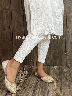 Comfortable and stretchable cotton ankle length pants with Lucknow Chikankari. This beautiful hand embroidered pants can be worn on any kurtis/ tunics. Cool and comfy ! Length:37.5 inches apprx  Inseam- 26 inches apprx  Embroidery designs vary. Ankle Length Pants With Kurti, Fitted Kurta With Chikankari Embroidery And Straight Pants, Traditional Straight Pants With Dabka Work, Diwali Salwar Kameez With Chikankari Embroidery And Straight Pants, Diwali Salwar Kameez With Chikankari Embroidery, Festive Straight Kurta With Chikankari Embroidery, Fitted Pants With Dabka Work For Eid, Bollywood Style Fitted Pants With Dabka Work, Anarkali Style Pants With Dabka Work For Diwali