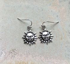 "☀️ Sun earrings, sun lover gift, statement suns for your ears, Tibetan silver sun earrings, perfect for summer, holidays or sun lovers! ☀️ I've made these using Tibetan silver charms hung from good quality silver plated earrings. ☀️ There's plenty of detail and they make a brilliant present or a summery treat for yourself. ☀️ Sun measures approximately 3/4\" (2 cm) long from the top of the hanging hoop. ☀️ I post out the same day or worst case scenario the next, unless it's the weekend then it' Silver Jewelry For Everyday Summer Wear, Everyday Summer Silver Jewelry, Sterling Silver Earrings For Everyday Summer Wear, Sunburst Earrings As Gift, Sunburst Shaped Jewelry As Summer Gift, Bohemian Summer Jewelry With Sun And Moon Design, Sunburst Shape Summer Gift Jewelry, Summer Sunburst Jewelry Gift, Bohemian Sun And Moon Design Jewelry For Summer