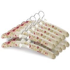 four pairs of clothes hangers with flowers on them