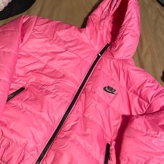 Pink Nike Therma-Fit Jacket. Size Xl. Never Worn. Meant To Return Due To Coming In Damaged On Right Side By Pocket But Forgot To Return. Tear Is Small And Can Be Sewed. Sporty Pink Hooded Puffer Jacket, Sporty Pink Puffer Jacket For Winter, Sporty Pink Puffer Outerwear, Nike Long Sleeve Puffer Jacket For Outdoor, Sporty Pink Puffer Jacket For Cold Weather, Pink Hooded Puffer Jacket For Streetwear, Nike Hooded Puffer Jacket For Spring, Nike Hooded Puffer Outerwear, Nike Long Sleeve Hooded Jacket For Winter