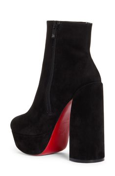 Pre-order this style today! Add to Shopping Bag to view approximate ship date. You'll be charged only when your item ships.A chunkier-than-most platform and lofty sculptural heel provide statement-making lift for this sleek ankle boot crafted of supple calfskin suede. Christian Louboutin's iconic red sole—born from a fateful brush with nail lacquer—adds a burst of signature color to every step. 5" (127mm) heel; 1 1/2" platform (size 38.5) 5" shaft Side zip closure Wipe with a soft, dry cloth and Modern High Ankle Suede Heeled Boots, Chic High Cut Leather Heeled Boots, Chic High-cut Leather Heeled Boots, Chic Platform Boots With Reinforced Heel And High Shaft, Chic High Shaft Platform Boots With Reinforced Heel, High Ankle Platform Boots For Formal Occasions, Chic Evening Platform Boots With Chunky Platform, Suede Platform Boots With Reinforced High Heel, Chic Suede High Heel Platform Boots