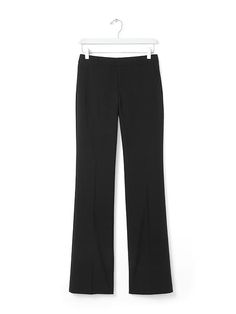 Meet our new menswear-inspired trouser: the Logan. These lightweight black wool trousers have a contoured waistband that molds to your body | Banana Republic Fitted Straight Silhouette Bottoms For Fall, Fitted Bottoms With Straight Silhouette For Fall, Straight Fitted Office Bottoms, Fitted Straight Bottoms For Office, Modern Fitted Straight Bottoms, Classic Fitted Straight Silhouette Bottoms, Straight Dress Pants With Button Closure For Work, Fitted Straight Silhouette Bottoms With Pockets, Tailored Straight Pants For Office