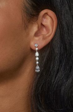 Complete your look with the sparkling glamour of these linear drop earrings set with faceted stones. 1 5/8" drop; 1/4" width Post back Rhodium or 18k-gold plate/cubic zirconia Imported Dangly Wedding Earrings, Formal Silver Jewelry, Crystal Long Drop Linear Earrings, Dazzling Linear Earrings With Diamond Accents, Long Drop Linear Earrings With Diamond Accents For Wedding, Formal Linear Earrings With Cubic Zirconia And Prong Setting, Classic Cubic Zirconia Long Drop Linear Earrings, Classic Long Drop Cubic Zirconia Diamond Earrings, Dazzling Linear Earrings With Diamond Accents And Cubic Zirconia