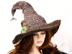 Ready for the Renfaire, a Steampunk festival, cosplay, a witch gathering, your table centerpiece, or just plain fun, this witch hat is firmly structured but soft to wear. Ready to navigate the forest or the sea, I've done this one with a bit of mariner steampunk and just a touch of forest. A steampunk style firefly dangles from the tip to light your way in the dark, with an octopus wrapped around an anchor at the base, and some ferns and feathers tucked behind. The way I stitch allows you to twist and shape or return it to straight up. The wired brim can also be shaped in any number of ways. When you're not wearing it, you can toss it on your table for a great conversational centerpiece, or hang it on a hook by the door! Folds flat for your travels. -This soft witchy hat has some stretch s Adjustable Wide Brim Costume Hats For Themed Events, Halloween Costume Cap, Wide Brim Hat For Carnival Costume Party, Brimmed Costume Accessories For Halloween Themed Events, Halloween Costume Party Cap, Themed Carnival Costume Hat, Witchy Hats For Halloween Costume Party, Gothic Adjustable Costume Hats For Fantasy Events, Adjustable Gothic Costume Hat For Fantasy Events