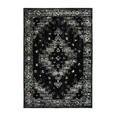 a black and white rug with an intricate design