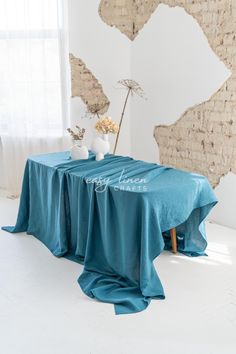 a table with a blue cloth draped over it