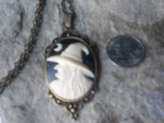 "For sale are beautiful flawless Halloween witch cameo pendant necklaces Gorgeous, and perfect for the Halloween season They are offered at a reasonable price, make perfect gifts, and are wonderful quality The cameos are set in pretty tibetan silver or bronze setting, please see the photo for size. The chain is 22\" .925 silver plated 1.2mm snake chain, with a lobster claw clasp, and for the bronze are 24\" adjustable rolo link chains I make several varieties, colors, styles and matching sets I Vintage Costume Necklaces For Halloween, Vintage Halloween Costume Necklaces, Vintage Halloween Pendant Jewelry, Vintage Halloween Costume Jewelry, Vintage Nickel Free Necklaces For Halloween, Vintage Nickel-free Necklace For Halloween, Handmade Magical Jewelry For Halloween, Cameo Pendant Necklace, Halloween Necklace