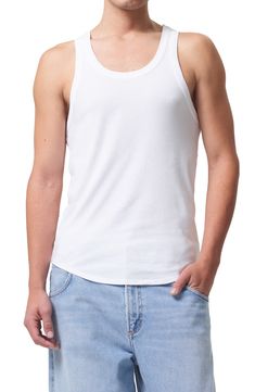 Cut from a ribbed organic-cotton blend, this tank is finished with banded trim and keeps you cool on its own or it makes a great addition to your layered look. 26" length (size Medium) Scoop neck 49% organic cotton, 49% Tencel® lyocell, 2% spandex Tencel lyocell is a sustainably produced fiber made with closed-loop processing Machine wash, dry flat Made in the USA Casual Cotton Ribbed Tank Top, Casual Ribbed Cotton Tank Top, Casual Ribbed Racerback Vest, Crew Neck Ribbed Cotton Tank Top, Ribbed Cotton Crew Neck Tank Top, Ribbed Cotton Vest, Solid Color Cotton Ribbed Vest, Solid Color Ribbed Cotton Vest, Ribbed Tank Top For Layering