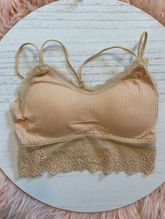 Lace Trim Bralette - Works for an everyday bra, or if you're wearing an off the shoulder top and going for a fun look! Comes in White, Tan & Mauve One-Size - Removable Padding Inserts Spring Stretch Cami Bra, Spring Cami Bra With Removable Pads, Strapless Stretch Bra For Spring, Spring Strapless Stretch Bra, Trendy Spring Bra With Removable Pads, Trendy Crop Top Bra For Spring, Trendy Spring Crop Top Bra, Strapless Bra With Removable Pads For Spring, Spring Stretch Bra With Lace Trim