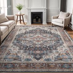 a living room with two couches and a rug on the floor in front of a fireplace