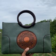 This is an exquisite mandala-carved handbag with first-rate finishing and a high-quality zipper. These are perfect for use as a daily use handbag or especially for special occasions to add an exotic touch to your look! Beautifully Carved Mandala and Artwork Bag: # Very Spacious # Comes with a Zipper # Very unique modern style bag # Vegan Leather # Comes with a shoulder strap Bohemian Shoulder Bag With Round Handle For Daily Use, Bohemian Bags With Round Handle For Daily Use, Bohemian Handheld Shoulder Bag With Detachable Handle, Top Handle Bags, Boho Bag, Bag Shoulder, Kind Words, Mandala Art, Amazing Jewelry