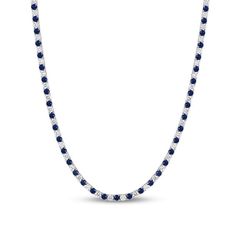 This luxe blue lab-created sapphire and diamond tennis necklace is bursting with color and sparkle. 10K white gold Diamonds, the largest being 1/8 ct. each, alternate with blue lab-created sapphires in a continuous line 8 cts. t.w. of diamonds 16.5-inch necklace; box clasp Classic Diamond Tennis Necklace With Gemstones, Sapphire Diamond Round Necklace, Round Gemstone Tennis Necklace Fine Jewelry, Dazzling White Gold Sapphire Necklace, Anniversary Gemstone Tennis Necklace, Anniversary Round Gemstone Tennis Necklace, Silver Necklace With Prong-set Lab-created Sapphire, White Gold Necklace With Diamond Cut Lab-created Sapphire, Silver Necklace With Lab-created Sapphire In Prong Setting