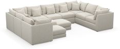 a large sectional couch with several pillows on the top and bottom, sitting in front of a white background