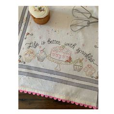 a table cloth with cupcakes on it