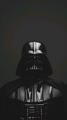 darth vader from star wars is shown in black and white with the dark background