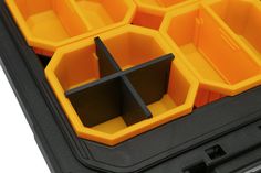 an orange and black case filled with yellow plastic containers on top of a white surface